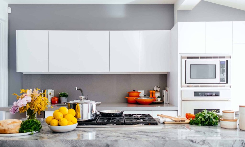 A rustic kitchen with functional appliances.