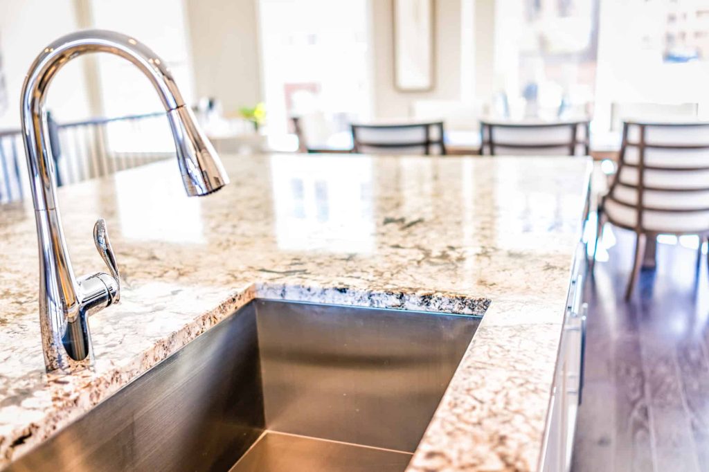 New modern faucet and kitchen room sink and granite top